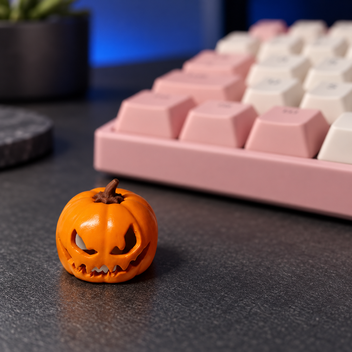 Pumpkin Glow orange keycap on a charcoal desk beside a keyboard. One keycap is included.