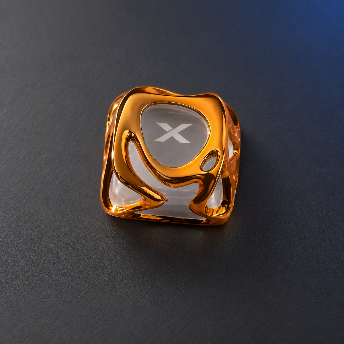 Molten Gold XVX keycap viewed from above, showing its irregular sculpted gold-colour outline.