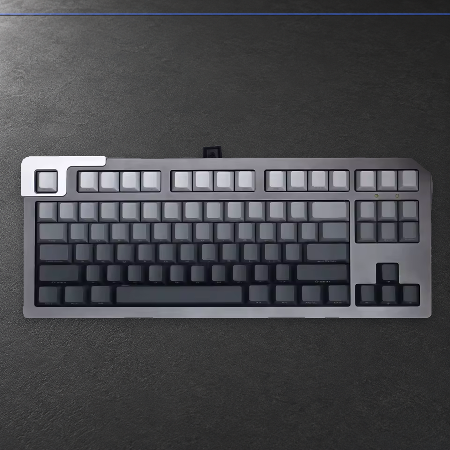 Color Drift grey gradient keycaps installed on a silver keyboard, full top view. Keyboard is not included.