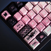 Close-up of Cool Cat Club pink and black keycaps. Keyboard not included.