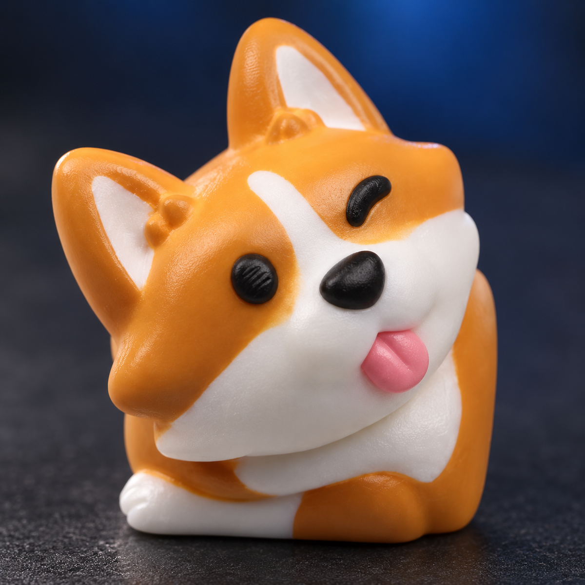 Corgi Charm resin keycap: close-up of the orange ears, white muzzle and pink tongue.