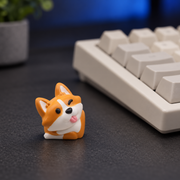 Corgi Charm keycap on a charcoal desk beside a keyboard, shown for styling inspiration. One keycap is included.