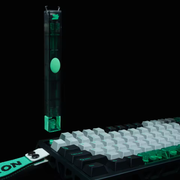 Green Gateron Twins tool above a mechanical keyboard on a dark background; keyboard and other props are not included.