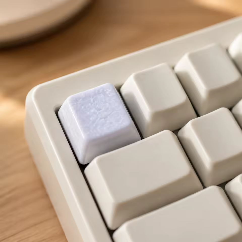 Supplier image showing the Glaze Accent keycap at the Escape position of a cream keyboard. Keyboard and other keycaps are not included.