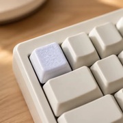Supplier image showing the Glaze Accent keycap at the Escape position of a cream keyboard. Keyboard and other keycaps are not included.