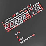 Supplier illustration of the Signal Red keycap set arranged on a dark background, with red and white tops, black sides and graphic legends.