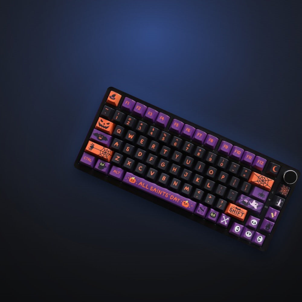 Haunted Night keycaps with pumpkin and ghost accents, angled view. Keyboard not included.