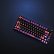 Haunted Night keycaps with pumpkin and ghost accents, angled view. Keyboard not included.