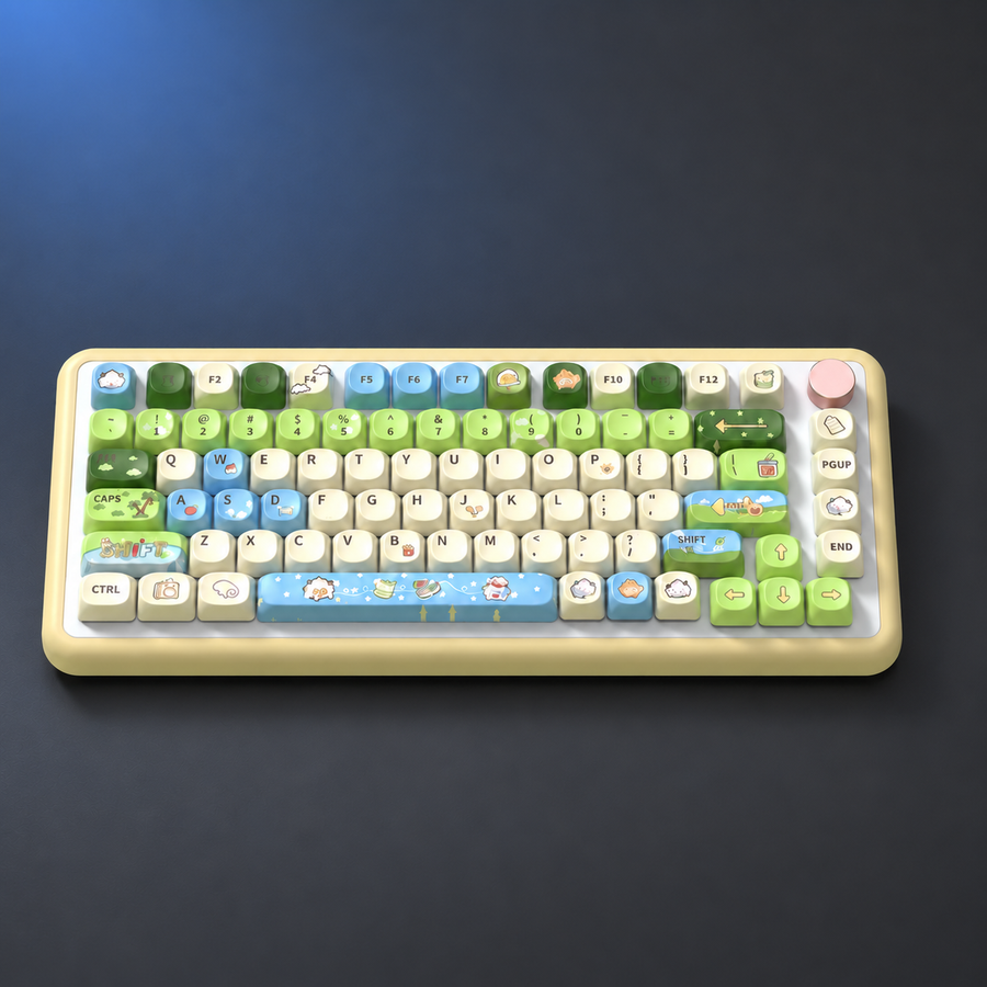 Meadow Notes green and pale blue illustrated keycaps, overhead studio view.