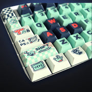 Close-up of Mint Melody mint and black keycaps. Keyboard not included.