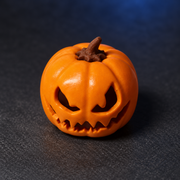 Pumpkin Glow orange resin keycap, full studio view of the sculpted pumpkin face.