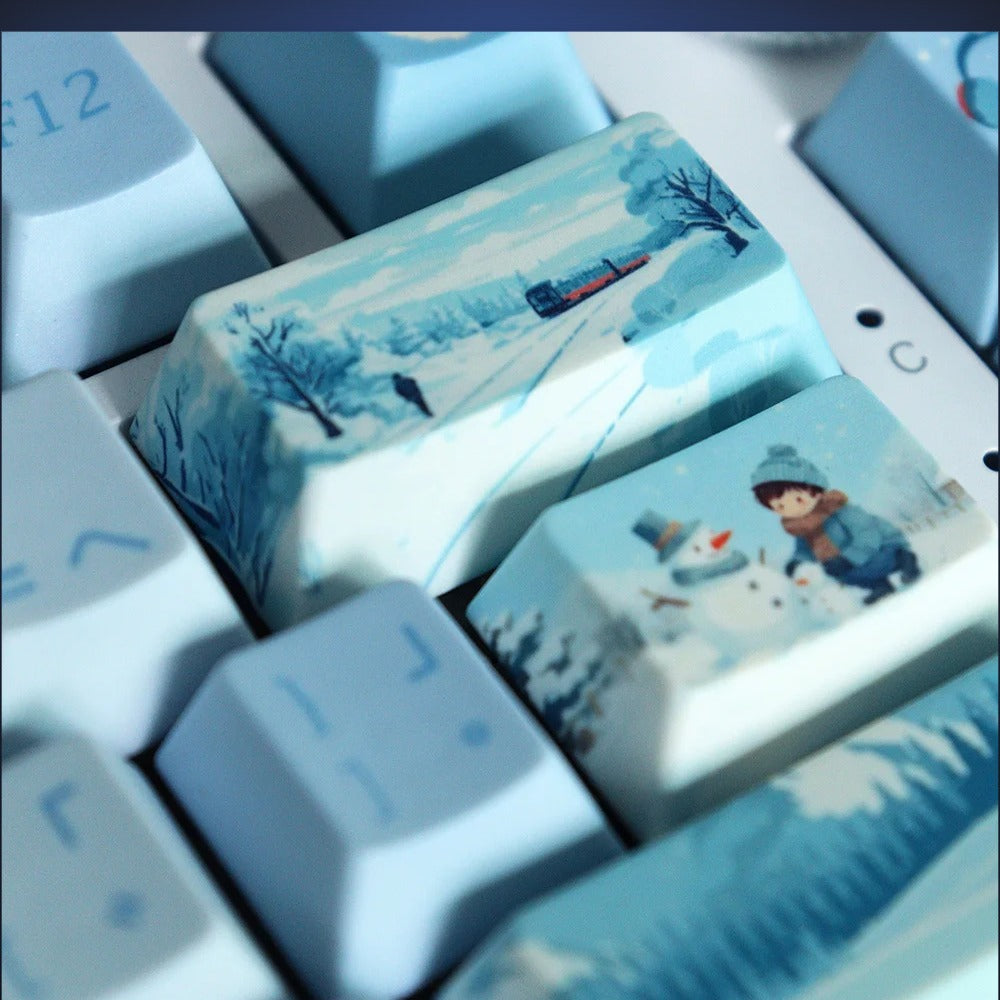 Close-up of Snowfall Village illustrated snow scene keys. Keyboard not included.