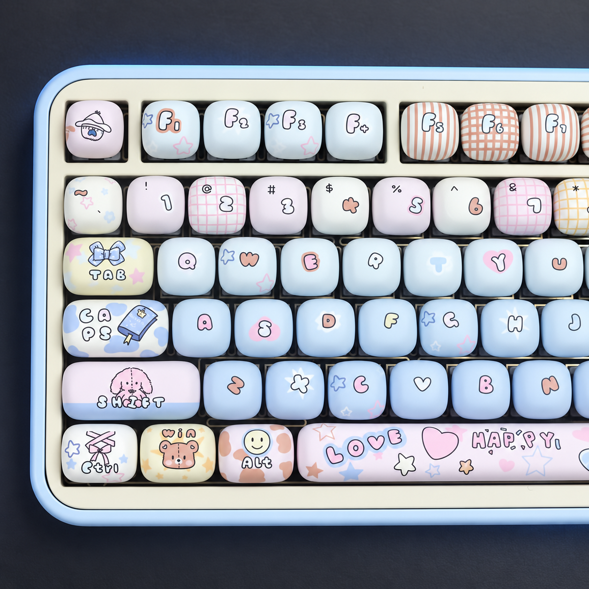 Playroom Blue keycaps installed on a keyboard — close overhead view of the left-hand keys